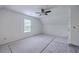 Bright bedroom featuring neutral walls and carpet, a ceiling fan, and a window offering plenty of natural light at 125 Eston Dr, Goose Creek, SC 29445