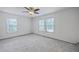 Spacious bedroom features two windows and ceiling fan at 125 Eston Dr, Goose Creek, SC 29445