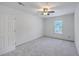 Clean bedroom with neutral carpet, a single window, fresh paint, and a ceiling fan at 125 Eston Dr, Goose Creek, SC 29445