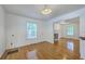 Bright dining room featuring hardwood floors, a window, and an open layout to the living room at 125 Eston Dr, Goose Creek, SC 29445