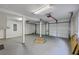 An empty three-car garage is lit with fluorescent lighting at 125 Eston Dr, Goose Creek, SC 29445