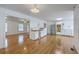 Spacious kitchen with newly refinished hardwood floors and white cabinets ready for appliances at 125 Eston Dr, Goose Creek, SC 29445