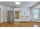 Kitchen with hardwood floors, stainless steel refrigerator, and white cabinets ready for appliances at 125 Eston Dr, Goose Creek, SC 29445