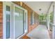 Inviting front porch with white railing and brick accents at 125 Eston Dr, Goose Creek, SC 29445