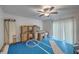 Unfinished storage room featuring a ceiling fan, exposed boxes, and a blue floor at 125 Eston Dr, Goose Creek, SC 29445