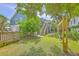 Relax in this big backyard with the home and trees in the background at 13 32Nd Ave, Isle of Palms, SC 29451