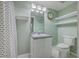 Cozy bathroom featuring a vanity, toilet, decorative lighting and striped shower curtain at 13 32Nd Ave, Isle of Palms, SC 29451