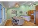 Open concept dining area adjacent to the kitchen, featuring unique decor and stylish furnishings at 13 32Nd Ave, Isle of Palms, SC 29451