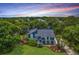 Lovely home with blue siding, mature trees, lush lawn, and well-manicured landscaping at 13 32Nd Ave, Isle of Palms, SC 29451