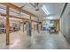 Spacious garage with exposed beams, golf cart, and boat at 13 32Nd Ave, Isle of Palms, SC 29451