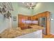 Well-equipped kitchen featuring stainless steel appliances, granite countertops, and ample wooden cabinetry at 13 32Nd Ave, Isle of Palms, SC 29451