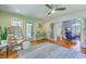Bright living room featuring hardwood floors, modern furniture, and sliding doors to an outdoor area at 13 32Nd Ave, Isle of Palms, SC 29451