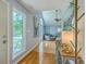 Open floor plan with wood floors, picture windows, vaulted ceiling, and modern furnishings at 13 32Nd Ave, Isle of Palms, SC 29451