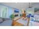 Cozy living room with stone fireplace, vaulted ceiling, hardwood floors, and serene decor at 13 32Nd Ave, Isle of Palms, SC 29451