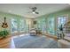 Inviting living room with lots of natural light from the surrounding windows and a comfortable chair at 13 32Nd Ave, Isle of Palms, SC 29451