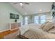Serene main bedroom featuring a vaulted ceiling, modern furniture, and natural light from multiple windows at 13 32Nd Ave, Isle of Palms, SC 29451
