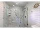 Contemporary shower featuring marble walls, glass door, and stylish fixtures at 13 32Nd Ave, Isle of Palms, SC 29451