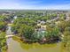 Aerial view of community with lush trees, a lake, and charming homes on a sunny day at 1317 Wild Olive Dr, Mount Pleasant, SC 29464