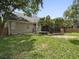 The backyard has a wood deck and is enclosed by a wood fence and mature trees at 1317 Wild Olive Dr, Mount Pleasant, SC 29464