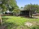 Large backyard has mature trees and lawn, enclosed by a wood fence for privacy at 1317 Wild Olive Dr, Mount Pleasant, SC 29464
