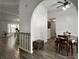 Open dining area with hardwood floors, archway entrance, and stylish table at 1317 Wild Olive Dr, Mount Pleasant, SC 29464