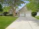 Charming single Gathering home featuring a brick facade, a two car garage, and a lush green lawn at 1317 Wild Olive Dr, Mount Pleasant, SC 29464