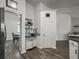Hallway with tiled backsplash, decorative cabinets and archway views of the breakfast area at 1317 Wild Olive Dr, Mount Pleasant, SC 29464
