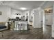 Open concept living area with a partial kitchen view, a sectional couch, and lots of natural light at 1317 Wild Olive Dr, Mount Pleasant, SC 29464
