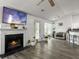 Bright living room with a fireplace, hardwood floors, and lots of natural light from the windows at 1317 Wild Olive Dr, Mount Pleasant, SC 29464