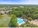 Aerial view of pool with lush greenery, cabana, lake and neighborhood at 1317 Wild Olive Dr, Mount Pleasant, SC 29464