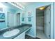 Well-lit bathroom featuring a spacious vanity with sink and a separate enclosed shower at 1327 Pinnacle Ln, Charleston, SC 29412