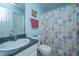 Cozy bathroom with a patterned shower curtain, vanity, and blue walls at 1327 Pinnacle Ln, Charleston, SC 29412