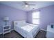 Bright bedroom with a comfortable bed, ample natural light, and stylish decor with lilac painted walls at 1327 Pinnacle Ln, Charleston, SC 29412