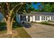 Townhouse exterior featuring a well-maintained lawn, updated landscaping and charming facade at 1327 Pinnacle Ln, Charleston, SC 29412
