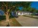 A beautiful exterior view of a townhome with mature trees surrounding the property at 1327 Pinnacle Ln, Charleston, SC 29412