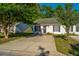 Exterior view of townhouses with mature trees, and well-maintained grounds and plantings at 1327 Pinnacle Ln, Charleston, SC 29412