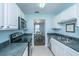 Well-lit kitchen with white cabinets and modern appliances leading into the dining area at 1327 Pinnacle Ln, Charleston, SC 29412