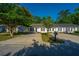View of the home exteriors from street, showing driveways and greenery at 1327 Pinnacle Ln, Charleston, SC 29412