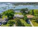 Stunning aerial view of waterfront home featuring a dock and lush landscaping with water views at 1467 Battalion Dr, James Island, SC 29412