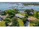 Lovely aerial view of home with waterfront access, private dock, and beautifully landscaped yard at 1467 Battalion Dr, James Island, SC 29412