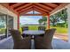 Inviting back porch with wood ceiling and rustic furniture with beautiful bay views at 1467 Battalion Dr, James Island, SC 29412