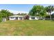 Expansive backyard with lush lawn, patio, and charming shed at 1467 Battalion Dr, James Island, SC 29412