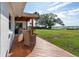 Spacious backyard featuring an extended deck overlooking a tranquil bay and lush greenery at 1467 Battalion Dr, James Island, SC 29412