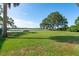 Expansive backyard featuring a well-maintained lawn leading to a serene bay, offering picturesque waterfront views at 1467 Battalion Dr, James Island, SC 29412
