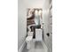 Modern powder room featuring striking wallpaper and contemporary fixtures, for a stylish and functional space at 1467 Battalion Dr, James Island, SC 29412