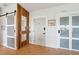 Modern entryway with wood accent wall, herringbone floors, and stylish doors at 1467 Battalion Dr, James Island, SC 29412