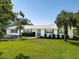 Beautifully landscaped single-story home with a well manicured lawn and elegant walkway at 1467 Battalion Dr, James Island, SC 29412