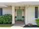 Charming front entrance with a decorative teal door and blooming hydrangeas at 1467 Battalion Dr, James Island, SC 29412