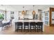 Bright, open kitchen with large island, modern stainless steel appliances, and stylish lighting at 1467 Battalion Dr, James Island, SC 29412