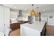 Bright, open kitchen with large island, modern stainless steel appliances, and stylish lighting at 1467 Battalion Dr, James Island, SC 29412